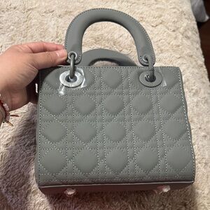 ‘Fashion bag’ in grey matte color. Perfect for on the go.